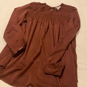 Beautiful burgundy top! Shirred at top.